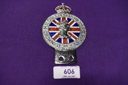 A coronation motor car engine badge dated 1953