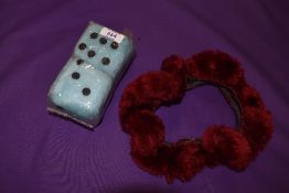 A vintage 1960s set of furry dice as new, and a steering wheel cover.