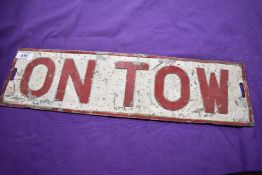 An 'ON TOW' plate