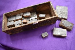 A crate containing 1950s and 60s Guy Lorry ink stamps, various models.