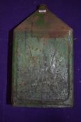 A large green garage five gallon oil or fuel can