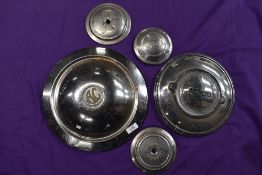 A selection of vintage motor car wheel hub caps including Ford Jaguar etc