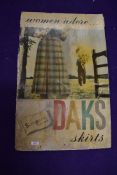 A vintage dress makers shop window advertising sign for DAKS Skirts