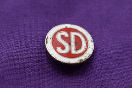 A shelvoke and D badge
