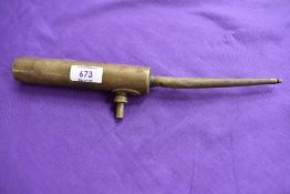 An Enots brass oil can.