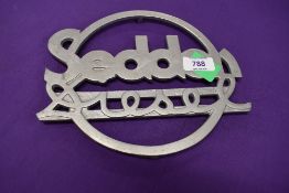 A cast metal sign for Seddon Diesel