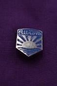 An Albion lapel badge.