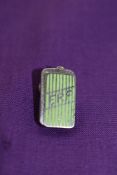 An ERF lapel badge.