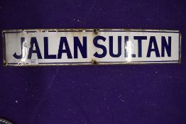 A vintage road side enamel sign reading Jalan Sultan