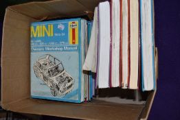 A selection of Haynes motor car instruction manuals and workshop guides including Ford and Mini