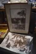 A framed photographic print of two children and another unframed one of Romany life/caravan