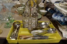A selection of cutlery and flatware loose also condiment set