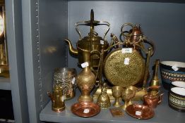 A fine selection of brass and copper items including dinner gong spirit kettle with stand and copper