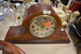 An inlaid wooden mantel clock