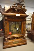 A 19th Century German carved mantel clock
