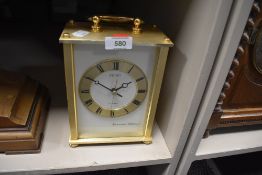A seiko brass effect mantel clock