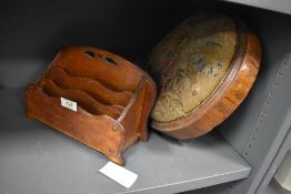 An Edwardian oak letter rack and similar antique circular footstool