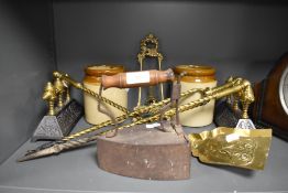 A fine selection of fire side items including brass and cast fire dogs with poker tong and shovel