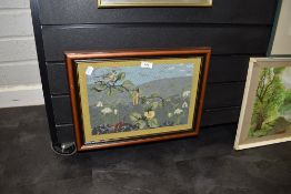 A needlework depicting bird and landscape