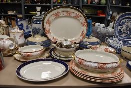 A selection of various tea and dinner wares including tureens and chargers