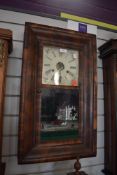 An American 30 hour wall clock by Rome and Co, New haven, Connecticut with enamel face