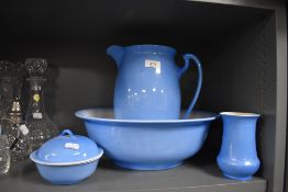 A wash jug and bowl set having a sky blue and cream glaze all pieces in good condition