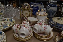 A part tea service by Elizabethan in the Queens Rose design and similar mantle clock