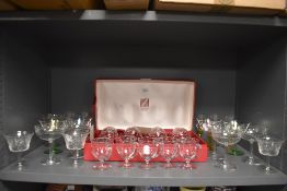 A selection of fine clear cut crystal and etched champagne wine and spirit glasses including Marie