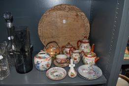 A selection of Chinese styled ceramics and porcelain including wooden bread board with dragon