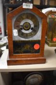 An American wood framed mantel clock