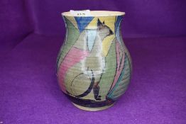 A hand painted art deco styled studio pottery vase marked Caton 5YR to base