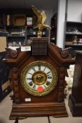 A wood framed mantel clock by Asonia Clock Co, New York with enamel face