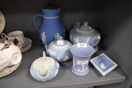 A selection of light blue ground Jasperware pottery by Wedgwood including tea pot with stand sugar