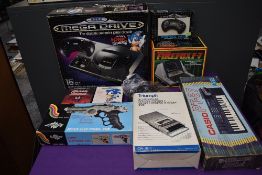 A Sega Mega Drive 16-Bit Console with two controllers and two games Maximum Carnage and Sonic the