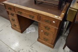A Victorian Aesthetic style oak pedestal desk, dimensions approx. W122 D68 H76cm