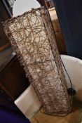 A wicker work floor lamp