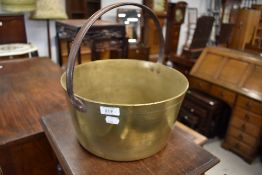 A traditional brass jam pan