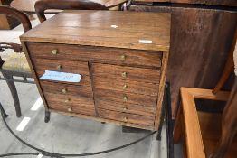 A dark oak set of one longer over ten short specimen drawers, approx. 39 x 33 x 36cm
