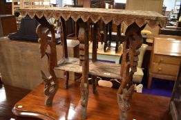 An Indonesian teak or similar hard wood carved table