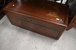 An Oriental bedding box, approx. 93cm, on shepherds castors