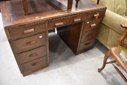 An early 20th Century oak pedestal desk