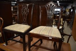 A late 18th century dining chair having carved back and a similar chair