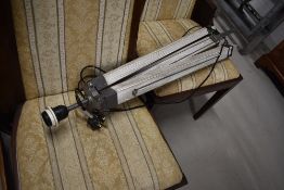 A reproduction tripod style standard lamp
