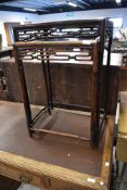 A nest of two oriental simulated bamboo occasional table