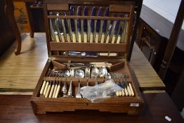 A 1930s Art Deco oak canteen of cutlery , blades stamped Smith Seymour Ltd. Sheffield