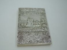 A Georgian silver castle top card case of rectangular form having a raised repousse scene of Windsor