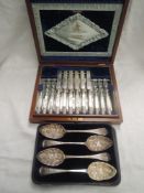 A canteen of twelve silver plated dessert knives and forks having mother of pearl handles and