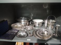 A selection of silver plate including lidded tureens, trays, cased butter knives, hip flasks, bottle