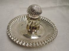 A Victorian silver inkstand having central moulded class inkwell with domed top on a gadrooned