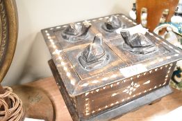 An Indonesian style carved lidded box with turtle handle and bone style inlay